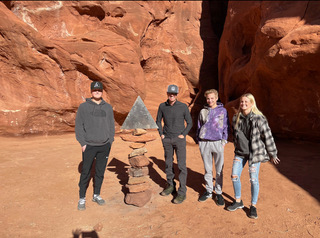 A group of Utah hikers pose with what remains of the famous Monolith on Saturday, November 28, 2020.