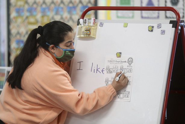 Edison Elementary School teacher Veronica Hernandez works on English with kindergarteners in her small group class at the school in Salt Lake City on Monday, Nov. 23, 2020.