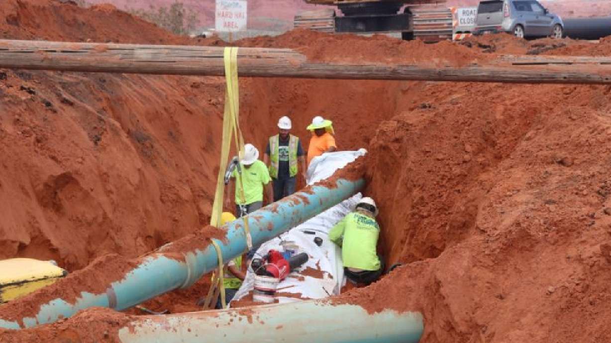 Construction crew installs segments of the pipe that will make the 11.5-mile long Sand Hollow Regional Pipeline designed to carry water from wells near the Sand Hollow reservoir to the southern part of Washington County, Utah, April 4, 2019
