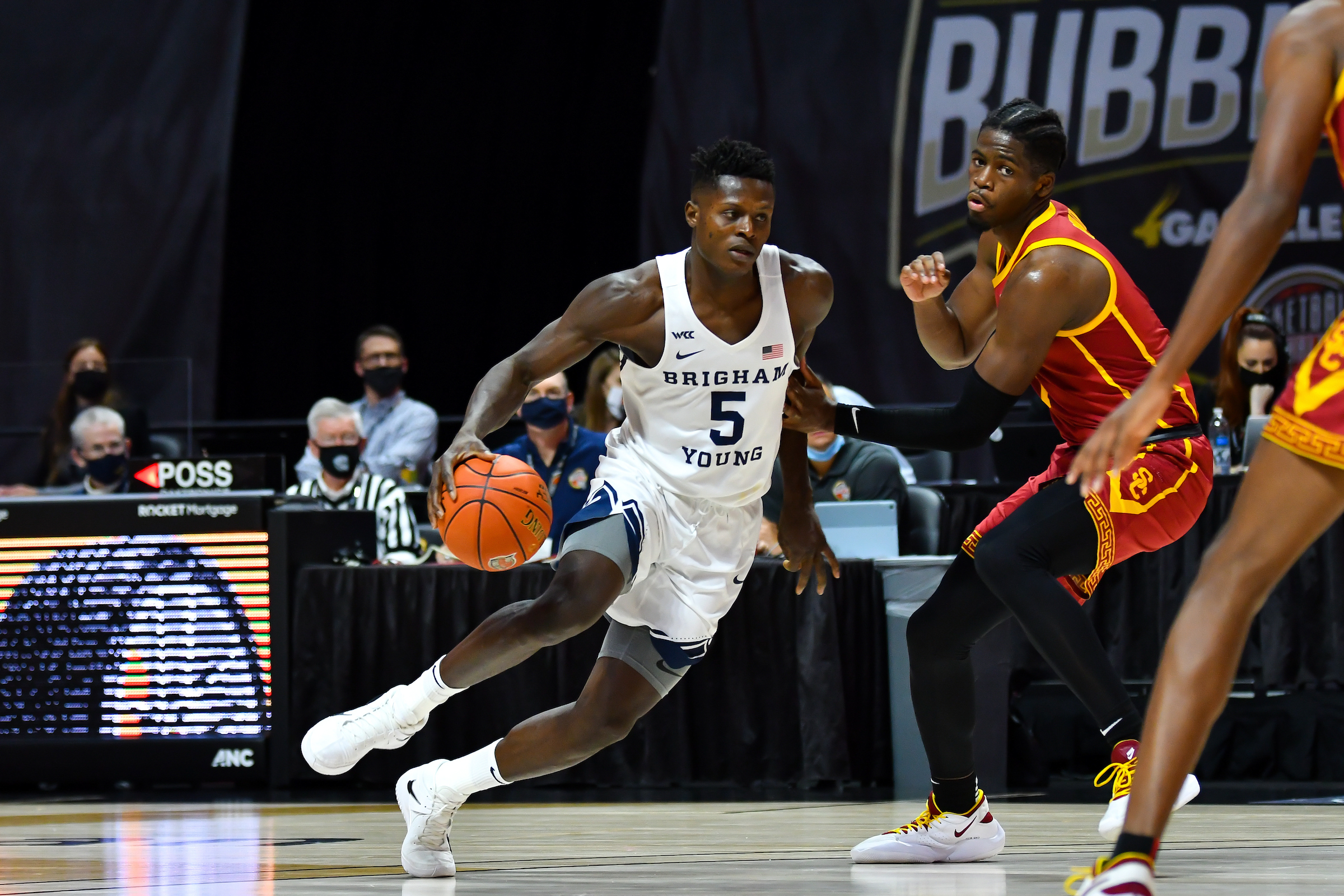 BYU forward Gideon George dribbles around the USC defense in the Legends Classic at "Bubbleville" Mohegan Sun Arena in an NCAA men's basketball game in Uncasville, Connecticut, Tuesday, Dec. 1, 2020.