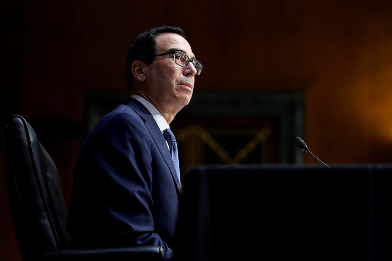 FILE PHOTO: Treasury Secretary Steven Mnuchin testifies before the Senate Banking Committee hearing on "The Quarterly CARES Act Report to Congress" on Capitol Hill in Washington, U.S., Dec. 1, 2020. Susan Walsh/Pool via REUTERS