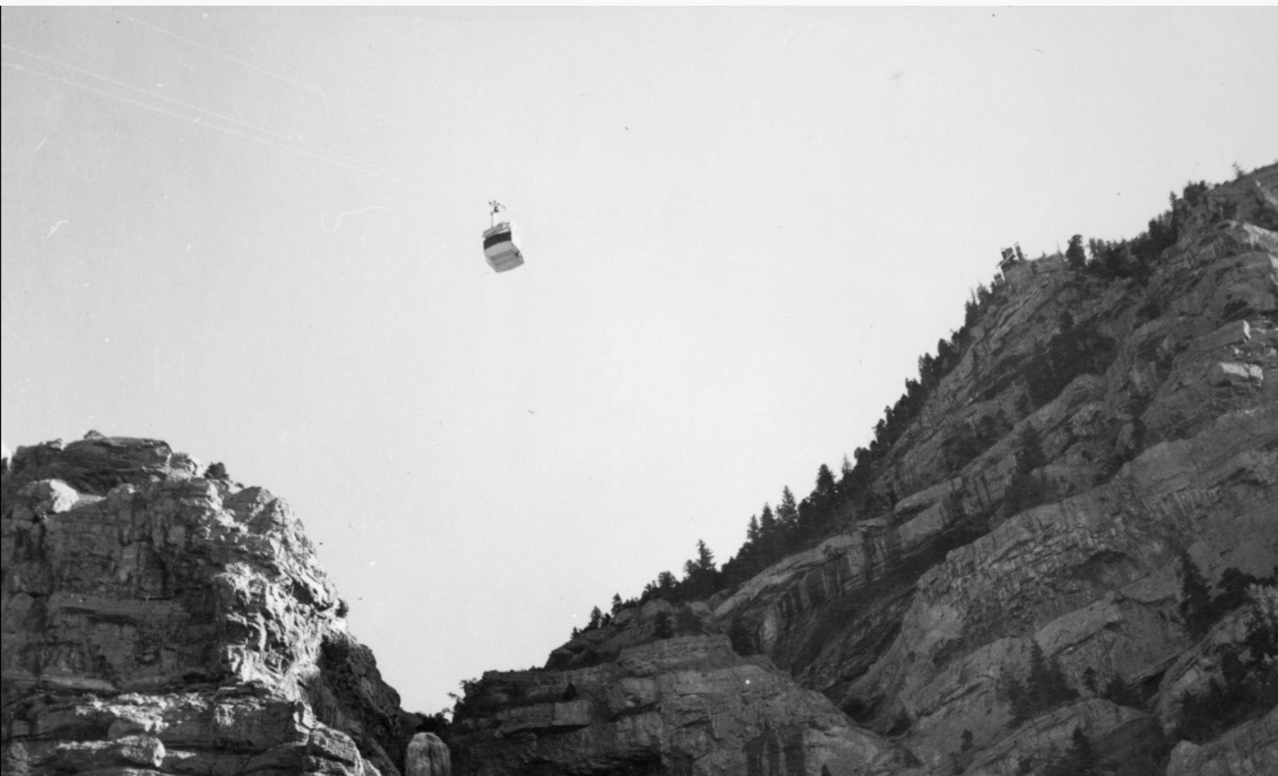 A photo of a tram car above Bridal Veil Falls taken sometime around 1961 through 1963, after the tram was first installed in the area.