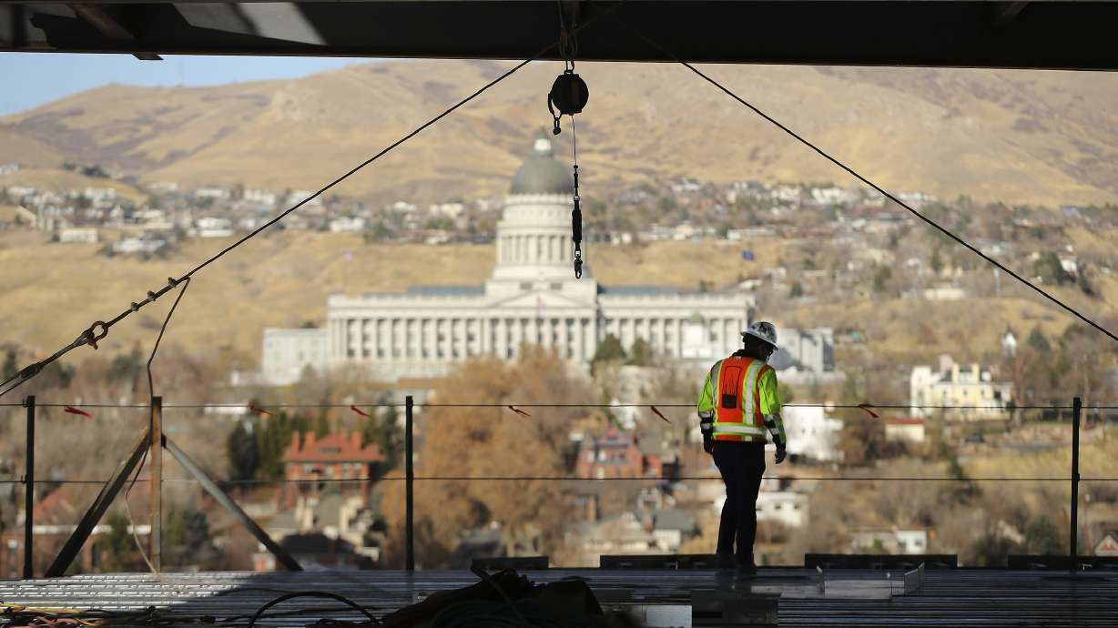 Sean Tuite, director of construction for City Creek Reserve, looks over the progress on 95 State at City Creek in Salt Lake City on Wednesday, Nov. 25, 2020. The 515,000-square-foot 25-story Class A office tower will feature cutting-edge technology incorporating state-of-the-art enhancements that allows touchless entry from the main door and throughout the property, thereby creating a safer and healthier workplace experience for tenants and visitors.