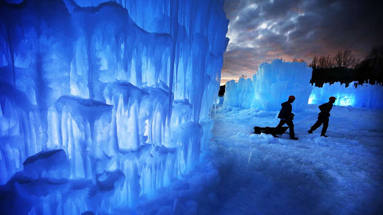 Hayden Richards and Jenson Rudd help build Ice Castles in Midway on Tuesday, Dec. 20, 2016.