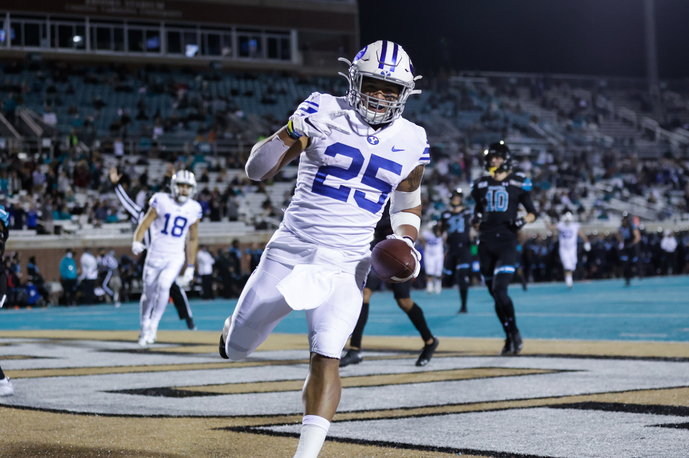 BYU running back Tyler Allgeier scores a touchdown during a game against Coastal Carolina, Saturday, Dec. 5, 2020, in Conway, South Carolina.