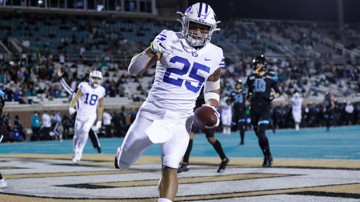 BYU running back Tyler Allgeier scores a touchdown during a game against Coastal Carolina, Saturday, Dec. 5, 2020 in Conway, South Carolina.