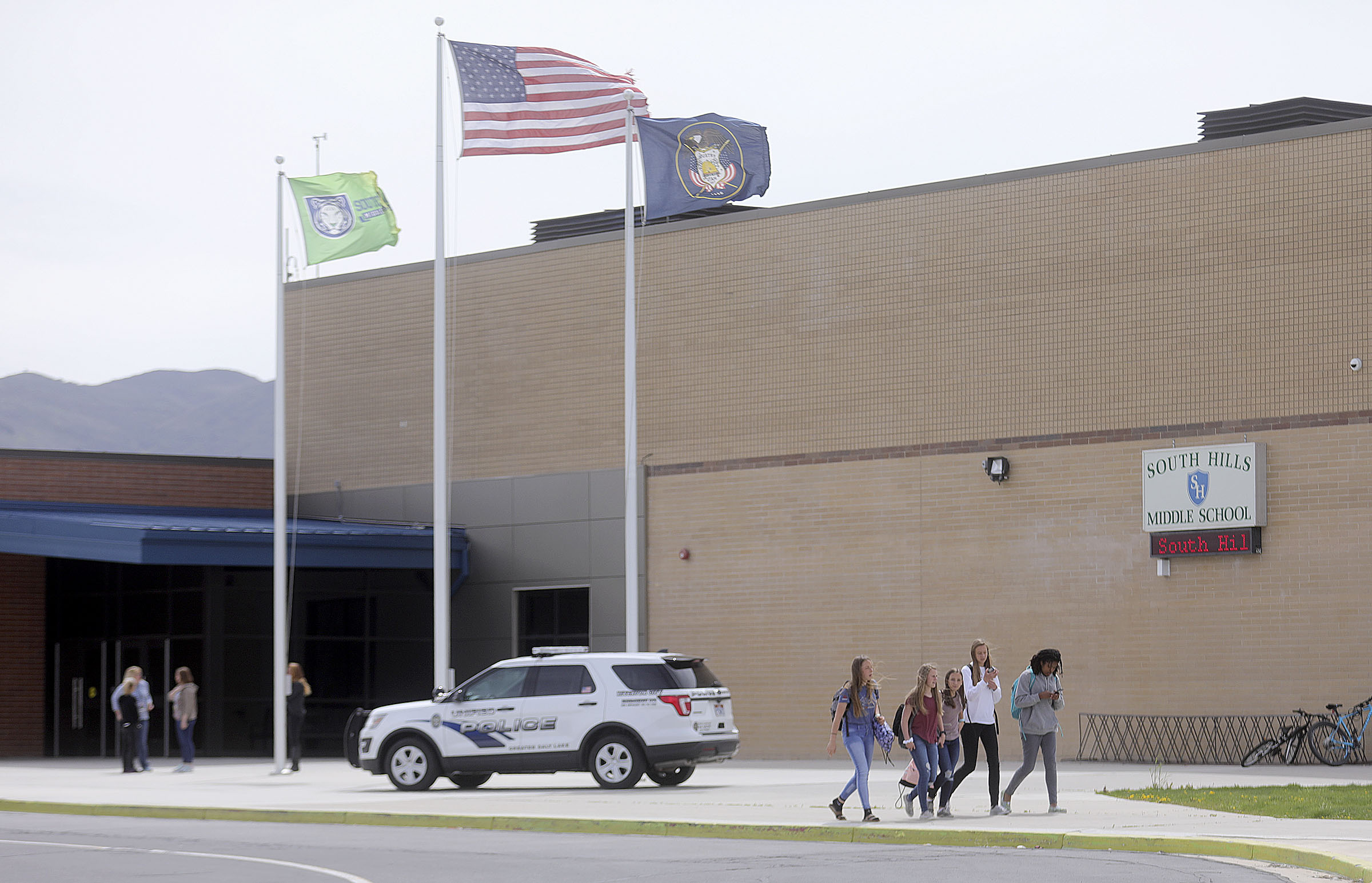 Students leave South Hills Middle School at the end of the day, after a man attacked a school resource officer and injured him with a piece of wood in Riverton on Monday, April 29, 2019.