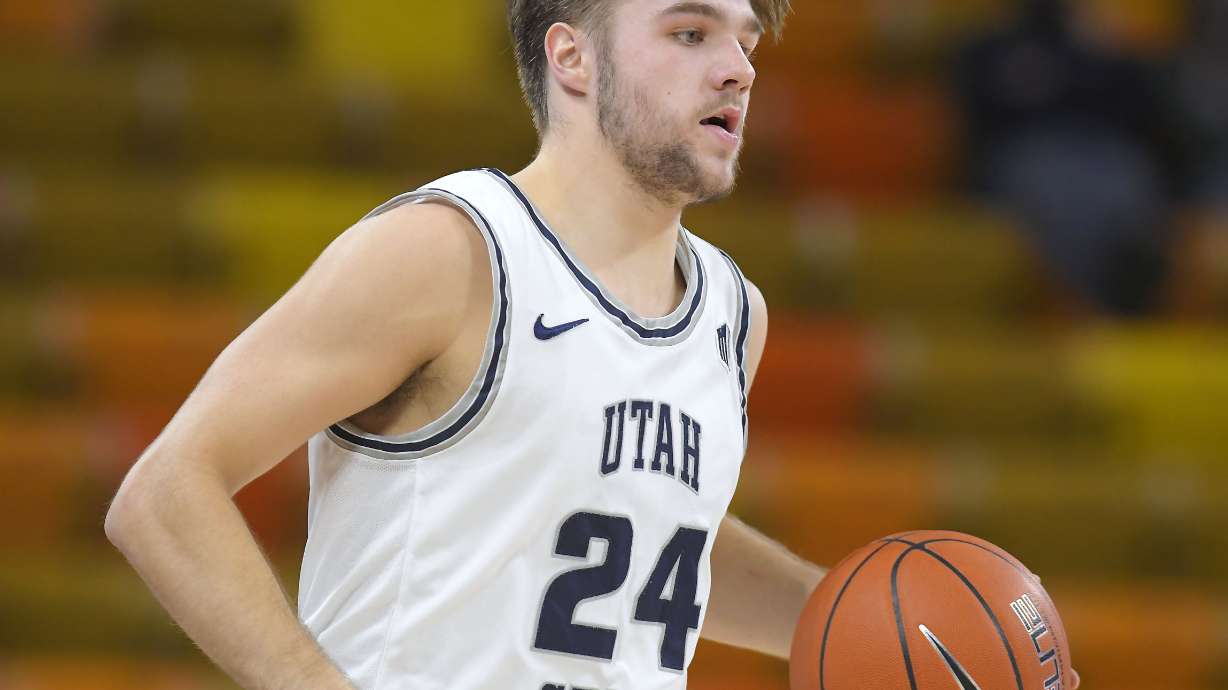 Utah State guard Rollie Worster brings the ball up the court against BYU the Cougars won an NCAA college basketball game 67-64 on Saturday, Dec. 5, 2020, in Logan, Utah.