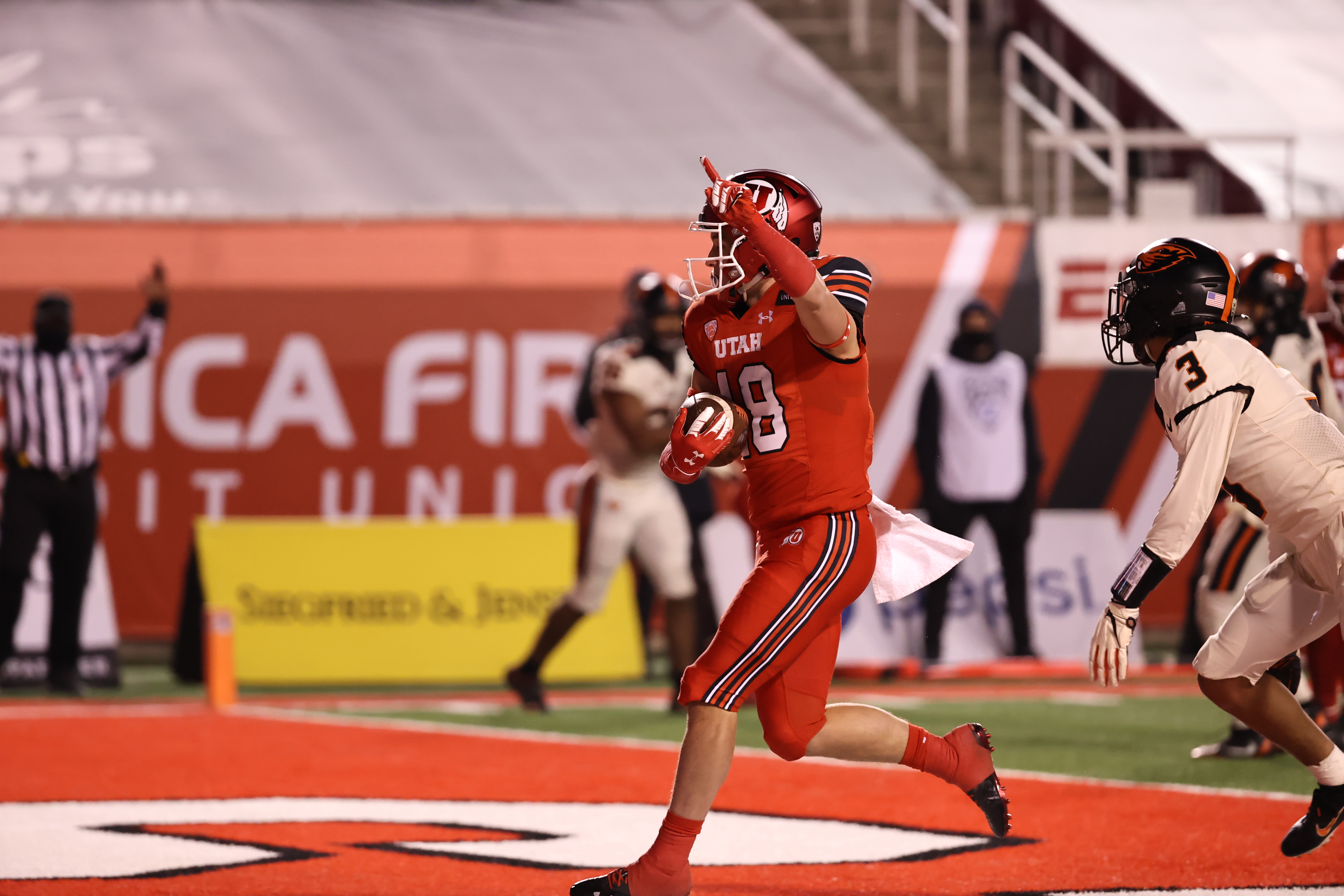 Britain Covey celebrates a touchdown against Oregon State at Rice-Eccles Stadium on Dec. 5, 2020.