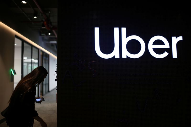 FILE PHOTO: Uber's logo is pictured at its office in Bogota, Colombia, December 12, 2019. REUTERS/Luisa Gonzalez