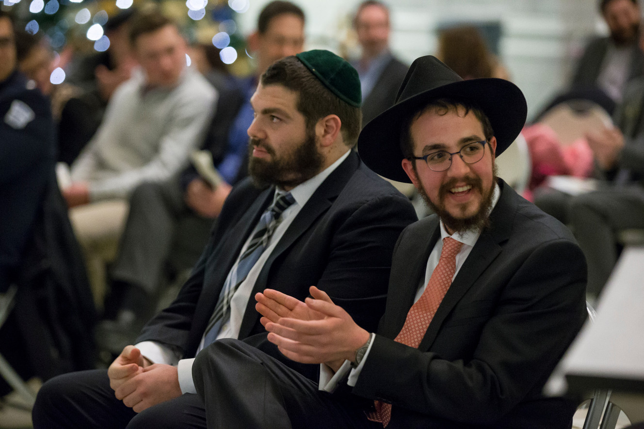 People attend a Menorah lighting to celebrate Hanukkah at the Utah State Capitol in Salt Lake City on Tuesday, Dec. 27, 2016.