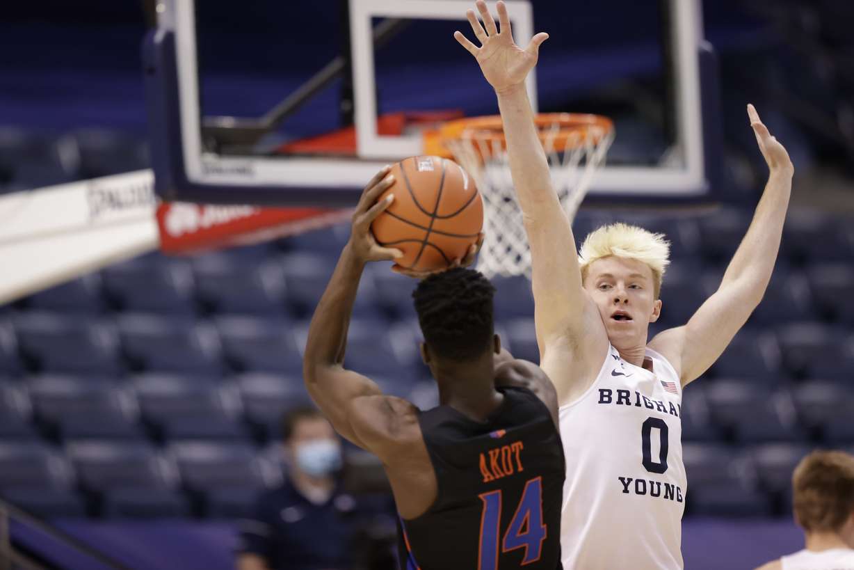 Boise State guard Emmanuel Akot takes a shot against BYU's Hunter Erickson during an NCAA college basketball game between BYU and Boise State, Wednesday, Dec. 9, 2020 at the Marriott Center in Provo.