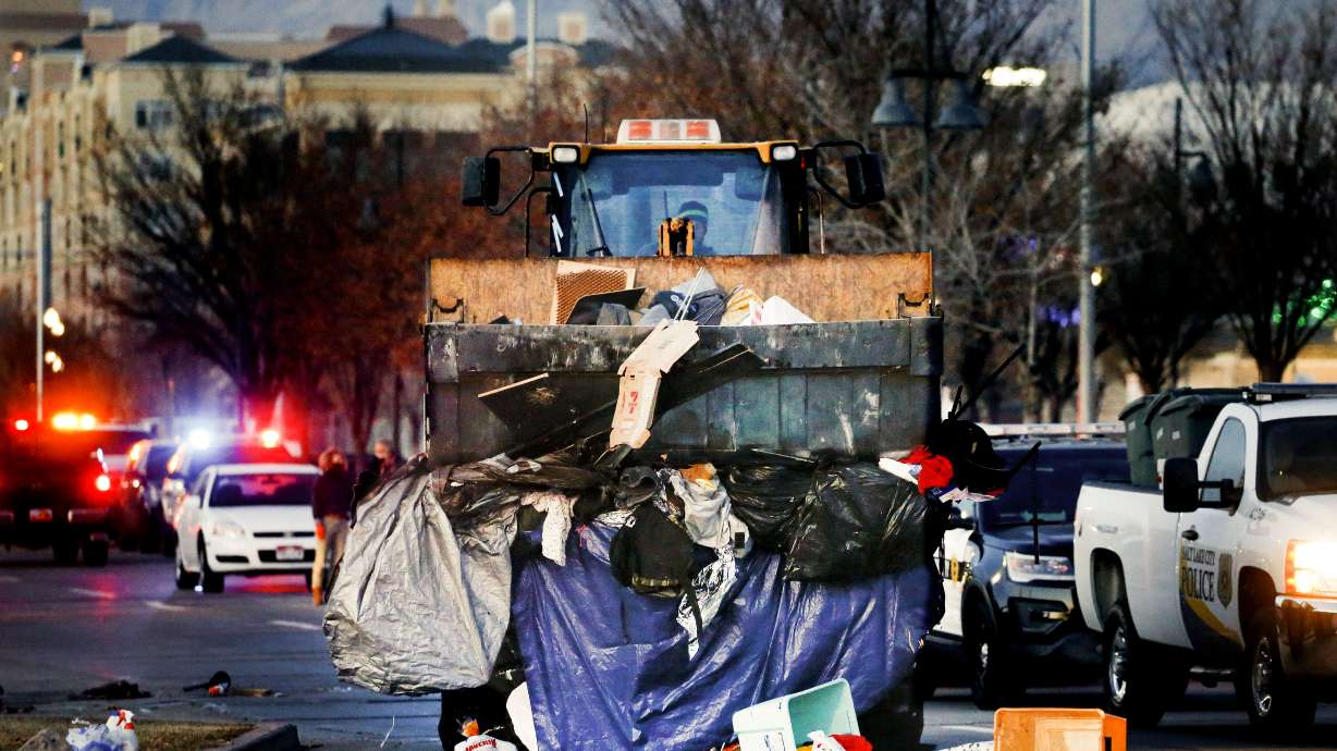 A bulldozer hauls away homeless people’s belongings as workers clean up homeless encampments in Salt Lake City. ACLU Utah filed an amicus brief with the Utah Supreme Court on Nov. 21 on behalf of people experiencing homelessness.
