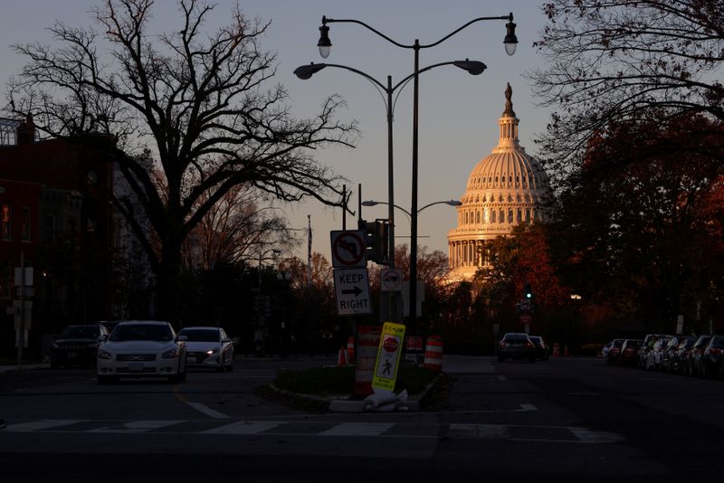 FILE PHOTO: The sunrise lights the dome of the U.S. Capitol in Washington, U.S. November 17, 2020.  REUTERS/Jonathan Ernst