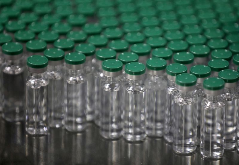 FILE PHOTO: Vials of AstraZeneca's COVISHIELD, coronavirus disease (COVID-19) vaccine, are seen before they are packaged inside a lab at Serum Institute of India, Pune, India, November 30, 2020.  REUTERS/Francis Mascarenhas/File Photo