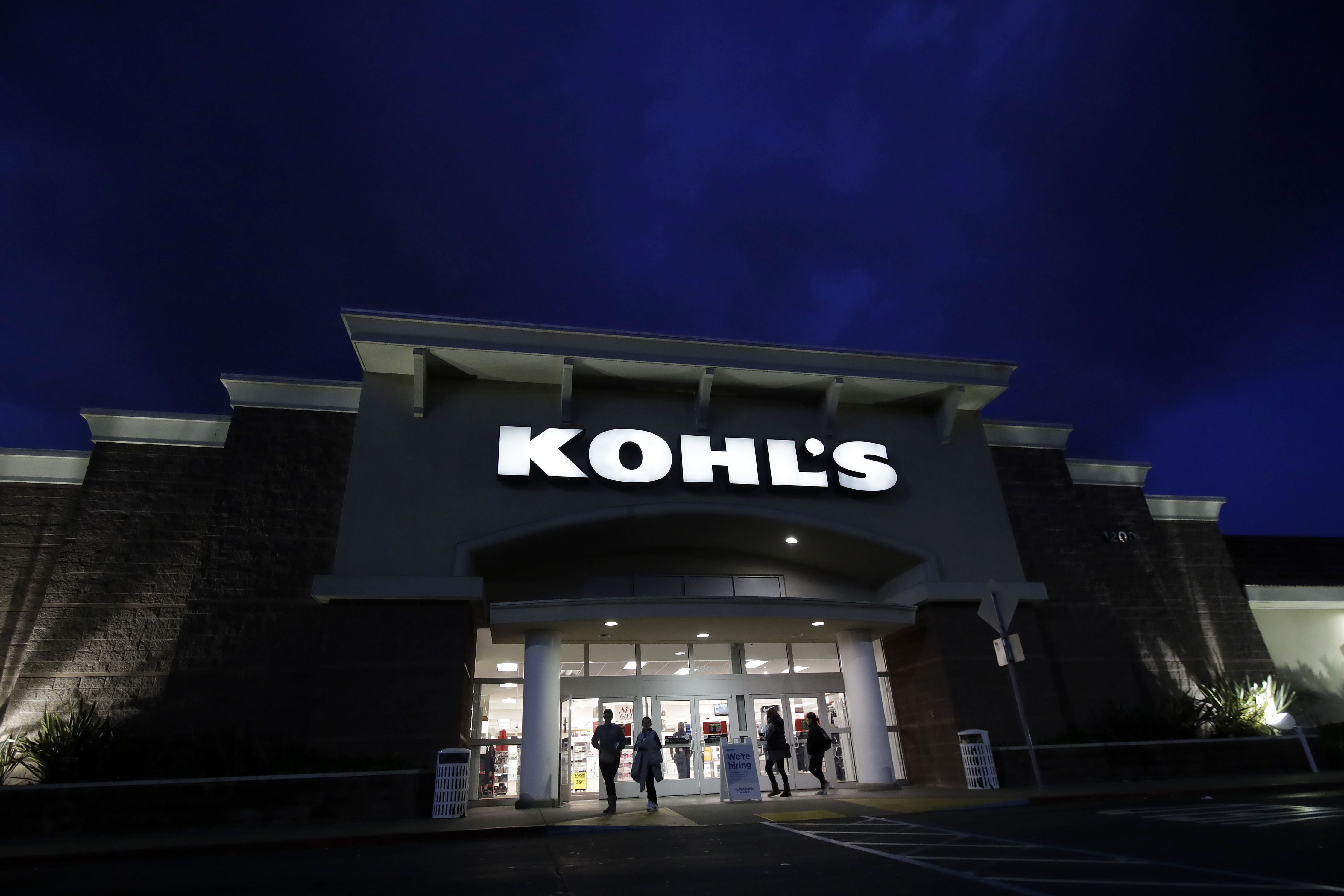 FILE - In this Nov. 29, 2019, file photo, customers walk outside of a Kohl's store in Colma, Calif. A number of stores including Kohl's, J.C. Penney, Ulta Beauty and others are encouraging shoppers on their websites to order online in the next few days - unless they want to pay for expedited shipping fees to ensure their items are delivered in time for Christmas. (AP Photo/Jeff Chiu, File) [Dec-11-2020]