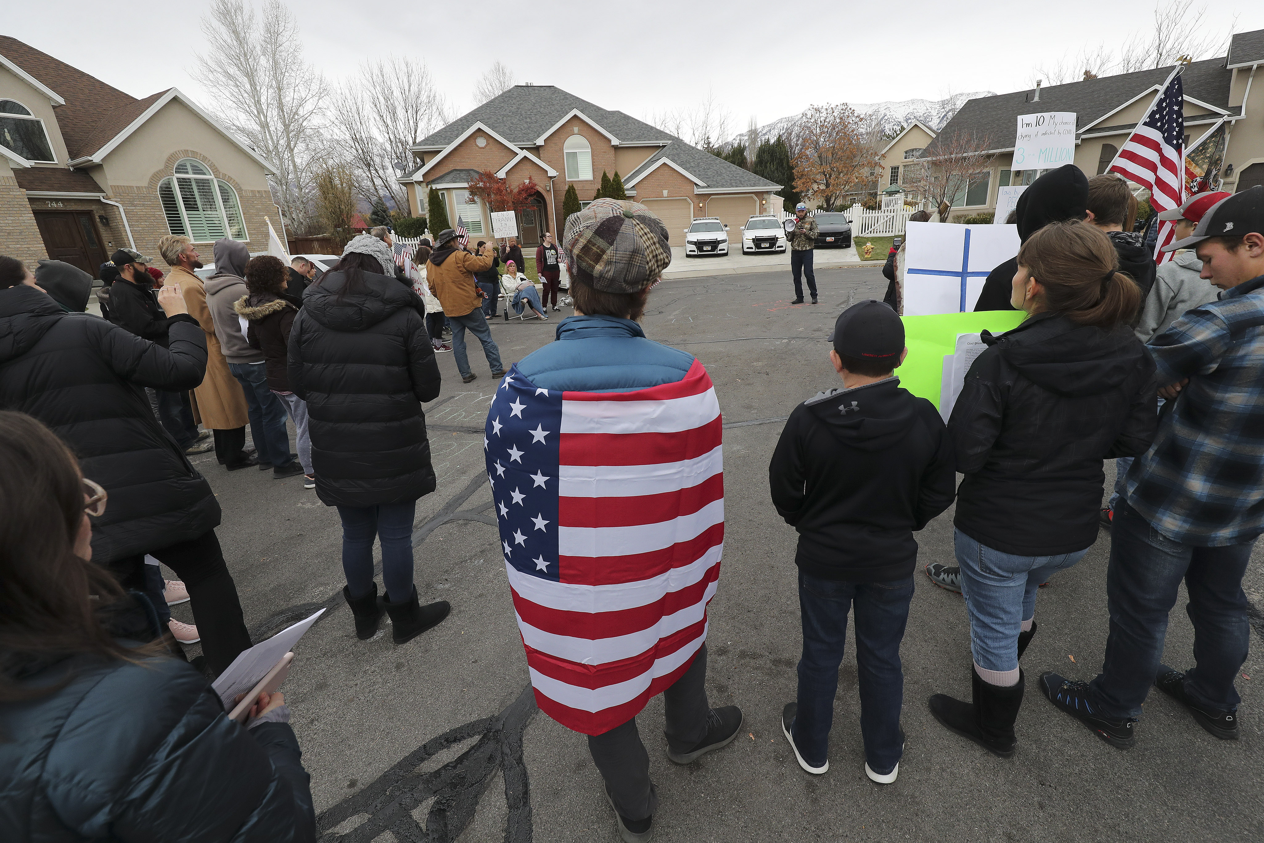 People who oppose wearing masks protest in front of Gov. Gary Herbert's private residence in Orem on Sunday, Nov. 15, 2020.