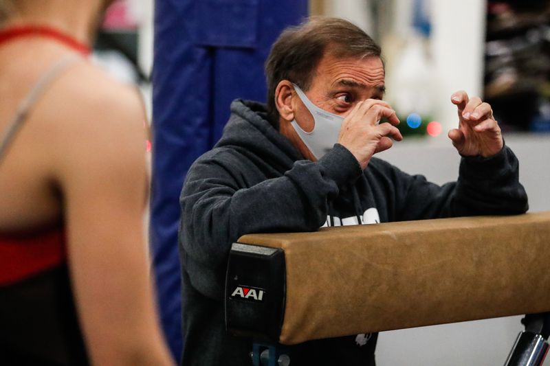Paul Hunt, owner and instructor of Hunt’s Gymnastics
Academy, instructs his students in Midvale on Friday, Dec. 11,
2020. Due to lost revenue from the coronavirus pandemic, the gym
will close at the end of the month.