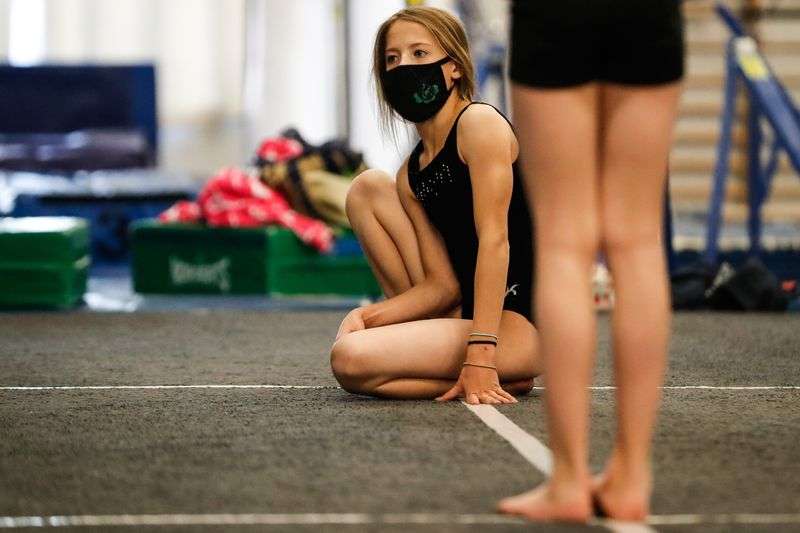 A student takes a break in the middle of a gymnastics
class at Hunt’s Gymnastics Academy in Midvale on Friday, Dec. 11,
2020. Due to lost revenue from the coronavirus pandemic, the gym
will close at the end of the month.