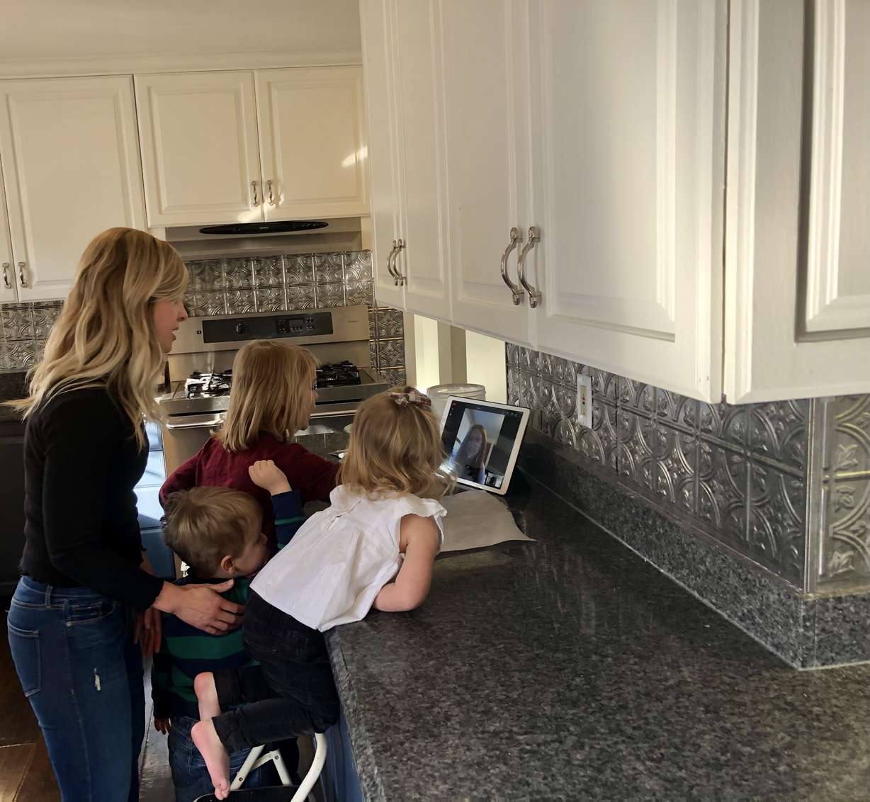 Jenny Jensen and her kids bake pies safely during the COVID-19 pandemic by calling Grandma on Zoom.