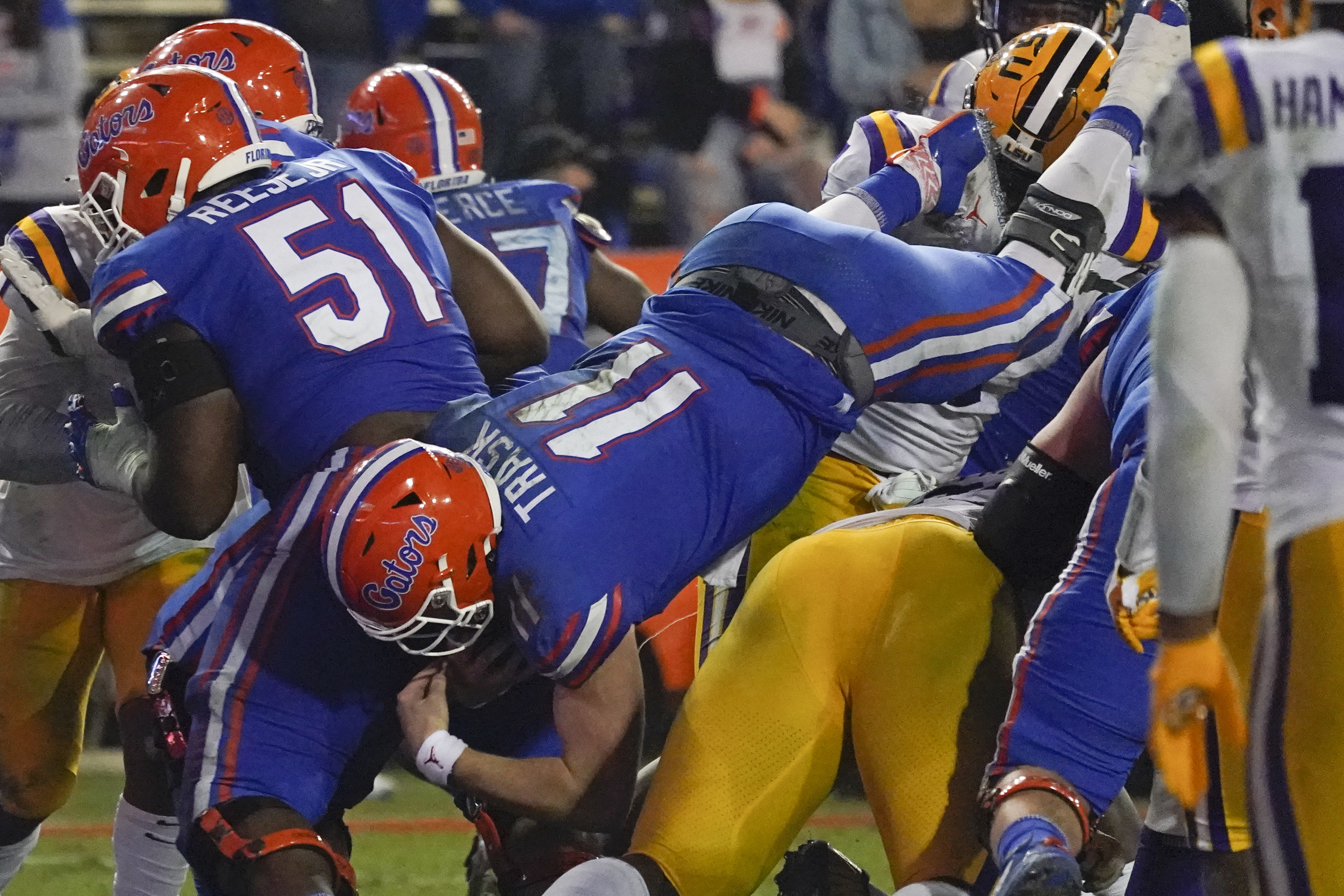 Florida quarterback Kyle Trask (11) dives over the LSU defense for a 1-yard touchdown during the second half of an NCAA college football game Saturday, Dec. 12, 2020, in Gainesville, Fla. (AP Photo/John Raoux) [Dec-12-2020]