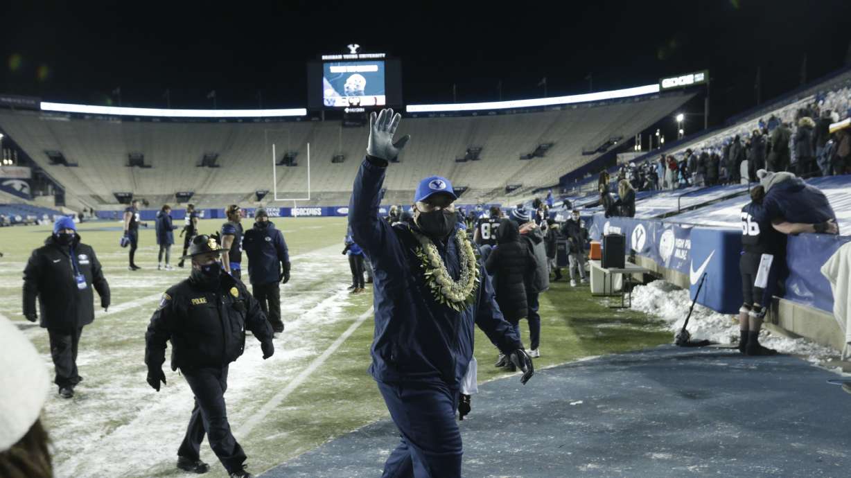 BYU coach Kalani Sitake waves to the family and close friends of BYU football players after the Cougars' senior night victory over San Diego State, Saturday, Dec. 12, 2020 in Provo.