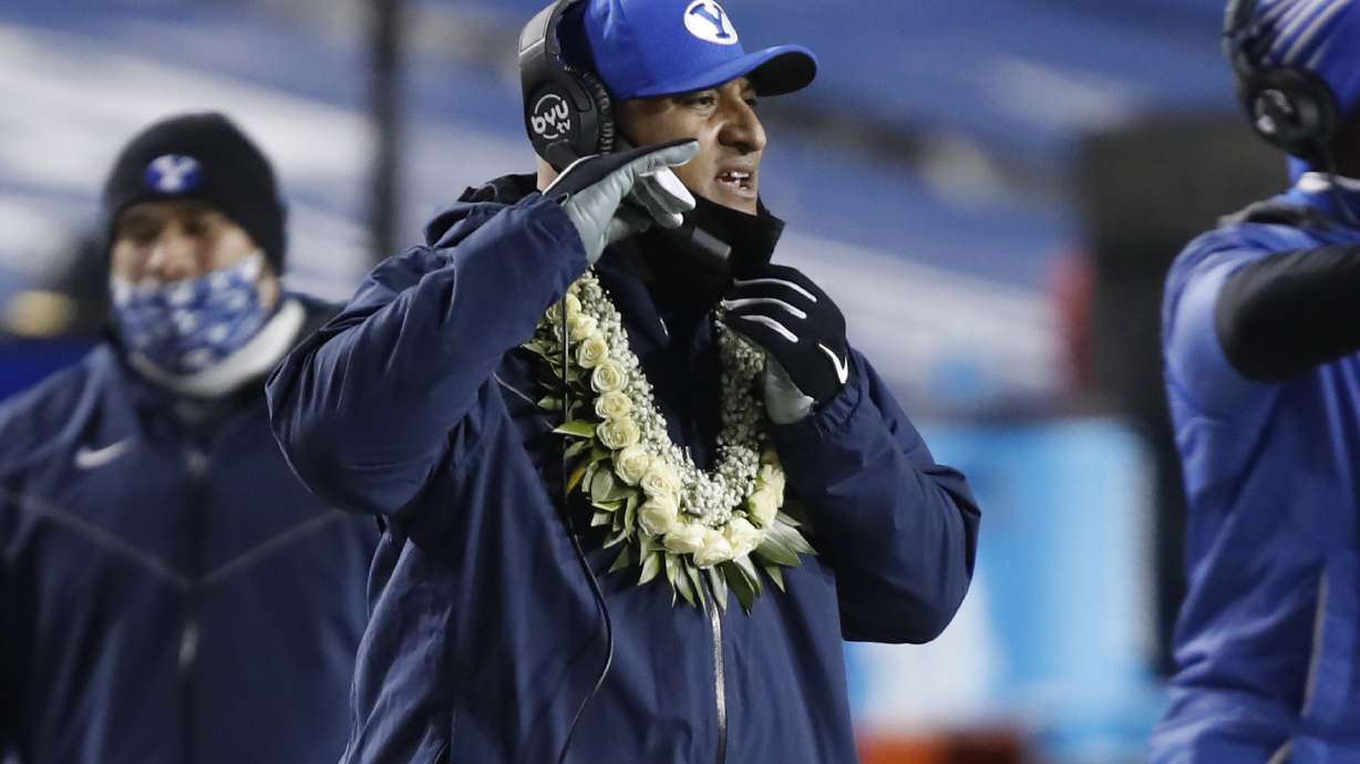 BYU coach Kalani Sitake watches the team during the first half of an NCAA college football game against San Diego State on Saturday, Dec. 12, 2020, in Provo, Utah. (AP Photo/George Frey, Pool)