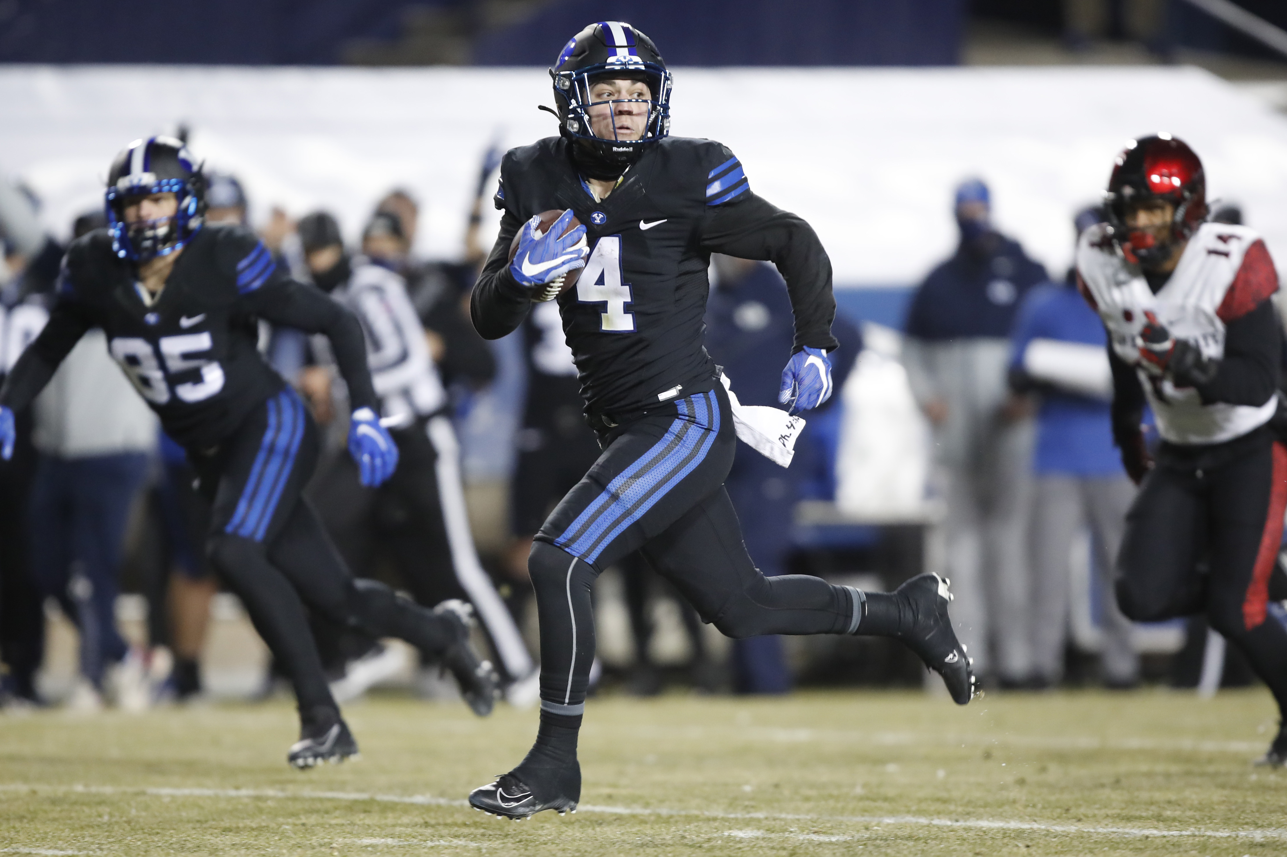 BYU running back Lopini Katoa, center, breaks a long run in the first half against San Diego State, on Dec. 12, 2020, in Provo.