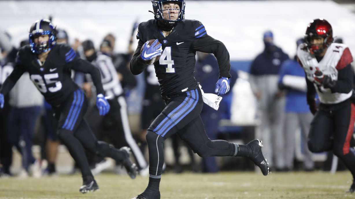 BYU running back Lopini Katoa (4) breaks a long run in the first half, of an NCAA college football game against San Diego State Saturday, Dec. 12, 2020, in Provo, Utah. (AP Photo/George Frey, Pool)