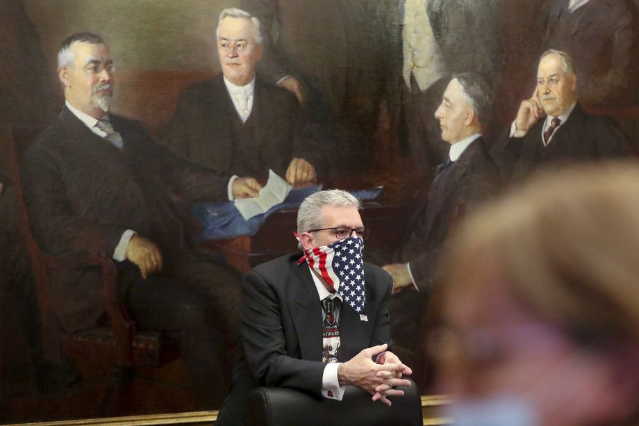 Washington County GOP Chairman Jimi Kestin wears an American flag face covering as he listens to instructions as Utah’s designated electors met in the board room at the Capitol to cast their ballots for president and vice president in Salt Lake City on Monday, Dec. 14, 2020. Utah’s six electoral votes went to President Donald Trump, who defeated Democrat Joe Biden in the popular vote in Utah 58% to 37%.