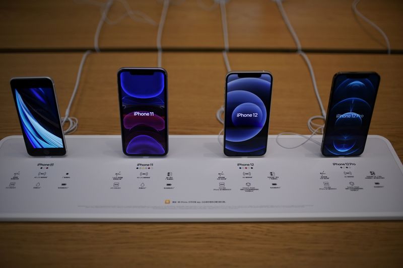 FILE PHOTO: Apple's 5G iPhone 12 and iPhone 11 are seen at an Apple Store, as the coronavirus disease (COVID-19) outbreak continues in Shanghai China October 23, 2020. REUTERS/Aly Song/File Photo