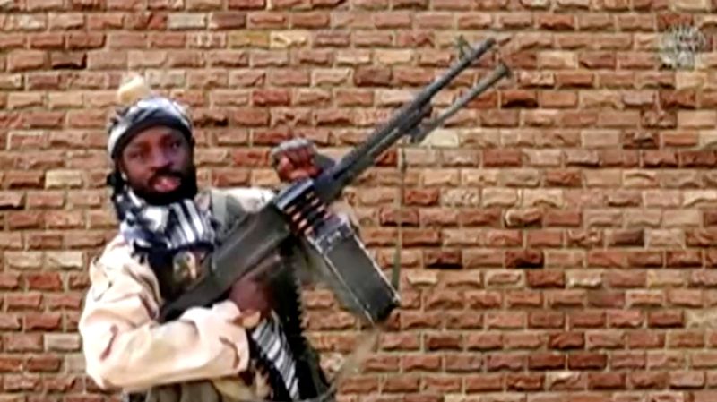 FILE PHOTO: The leader of one of the Boko Haram group's factions, Abubakar Shekau, holds a weapon in an unknown location in Nigeria in this still image taken from an undated video obtained on January 15, 2018. Boko Haram Handout/Sahara Reporters via REUTERS