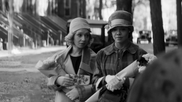 This image released by the Sundance Institute shows Ruth Negga, left, and Tessa Thompson in a scene from "Passing." The film, a directorial debut by Rebecca Hall, will debut at the 2021 Sundance Film Festival.