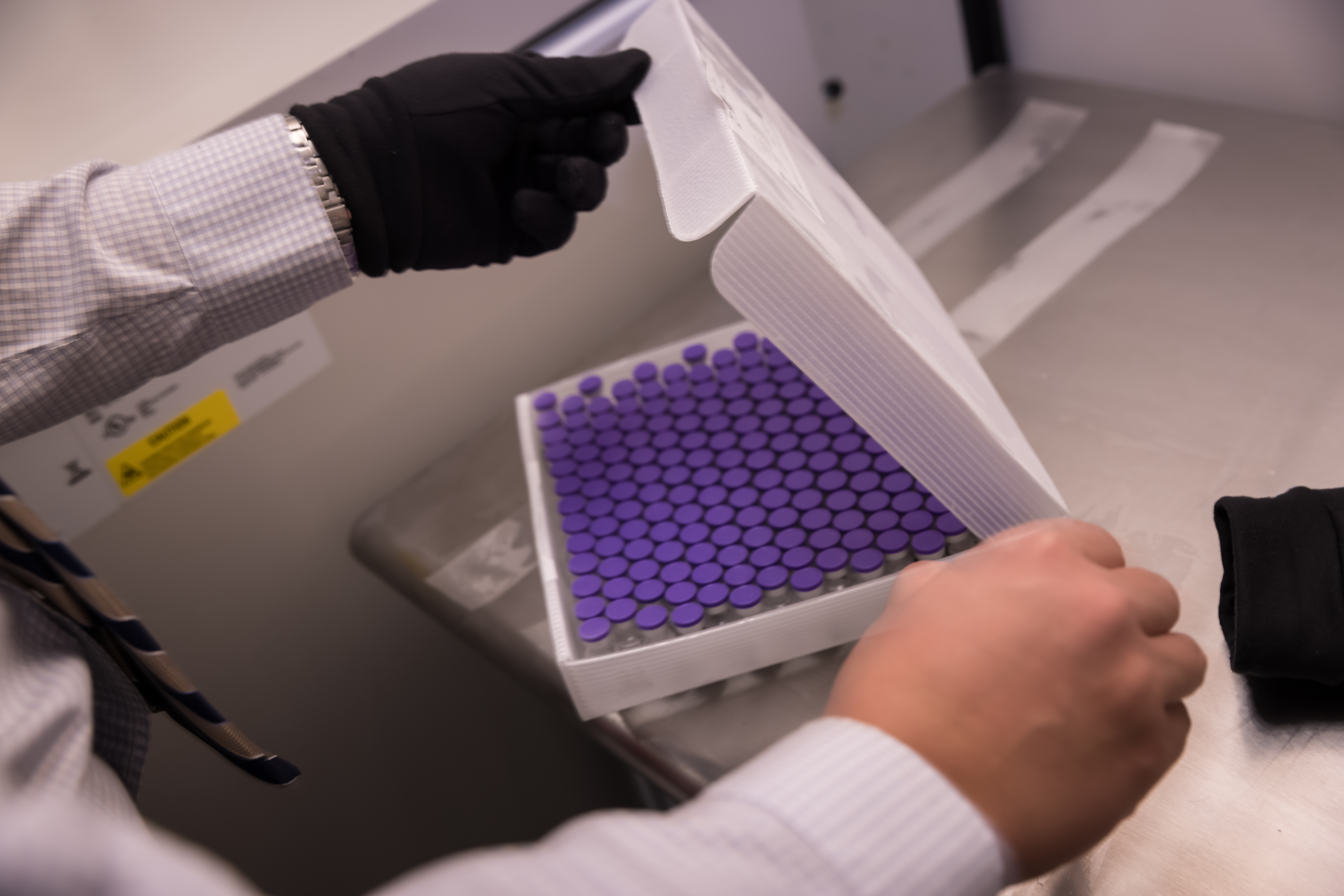 Doses of the Pfizer COVID-19 vaccine are unloaded after they arrived at the University of Utah Hospital on Tuesday, December 15, 2020.