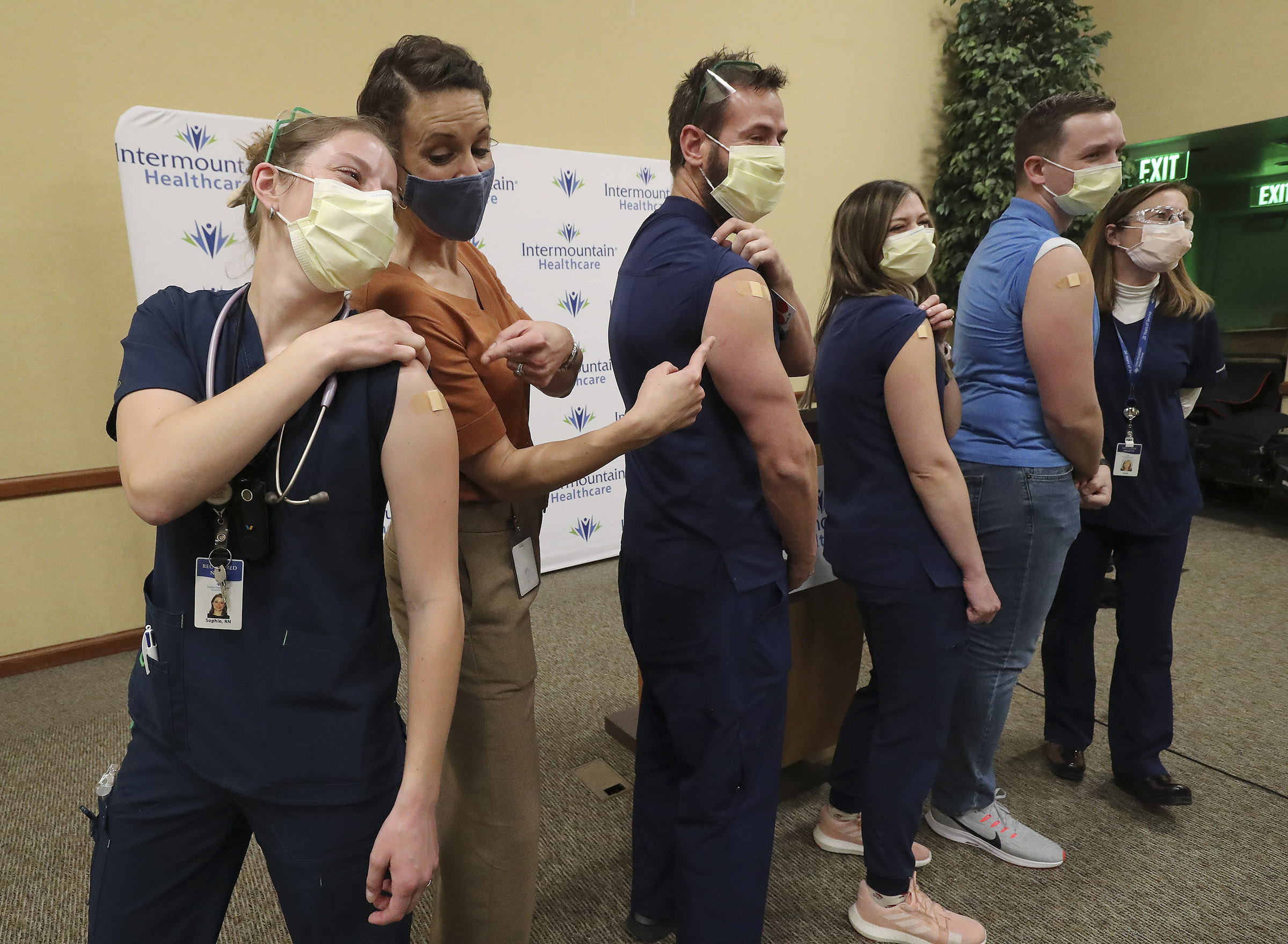 Registered nurse Sophie Woodbury, left, poses for a photo with state epidemiologist Dr. Angela Dunn, and fellow registered nurses Monte Roberts, Amanda Vicchrilli, William Brunt and Julie Nelson at LDS Hospital in Salt Lake city on on Tuesday, Dec. 15, 2020. Woodbury, Roberts, Vicchrilli and Burnt were vaccinated for COVID-19 by Nelson.