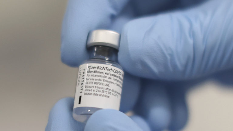 A phial of the Pfizer-BioNTech COVID-19 vaccine at the Royal Victoria Hospital, in Belfast, Tuesday Dec. 8, 2020. The United Kingdom, one of the countries hardest hit by the coronavirus, is beginning its vaccination campaign, a key step toward eventually ending the pandemic.