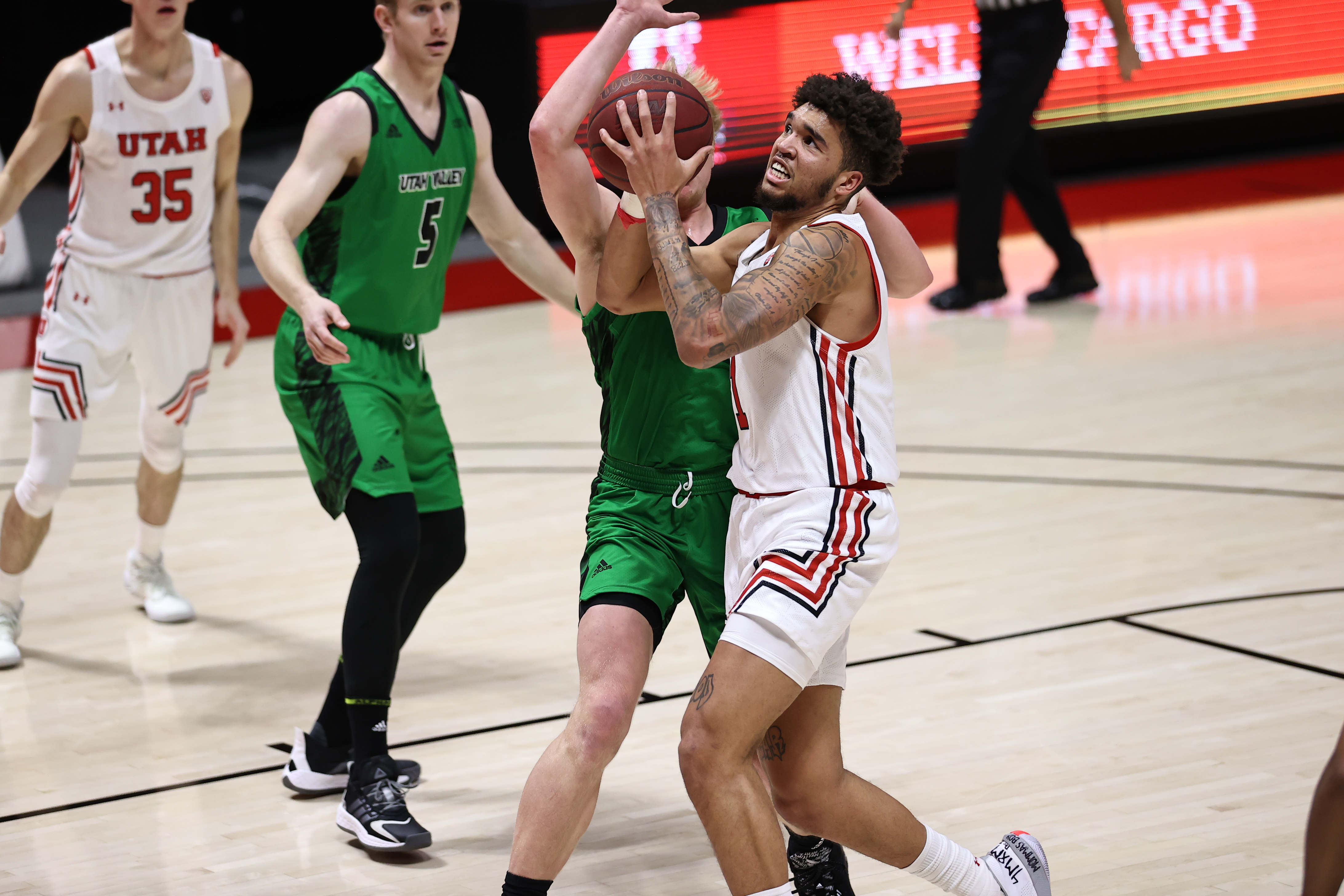 Utah forward Timmy Allen drives to the basket as the Utes play Utah Valley at the Huntsman Center in Salt Lake City on Dec. 15, 2020.