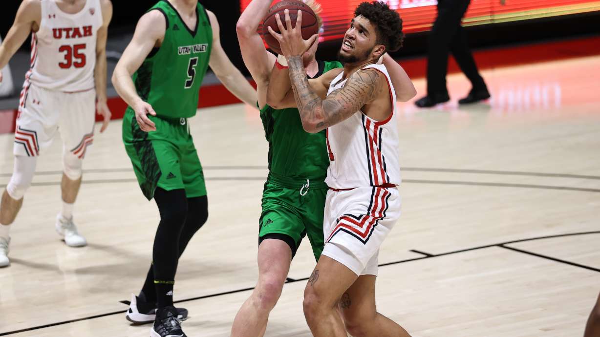 Utah forward Timmy Allen drives to the basket as the Utes play Utah Valley at the Huntsman Center in Salt Lake City on Dec. 15, 2020.