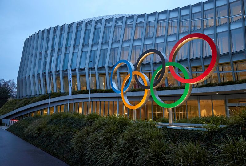 FILE PHOTO: The Olympic rings are pictured in front of the International Olympic Committee (IOC) in Lausanne, Switzerland, December 7, 2020. REUTERS/Denis Balibouse