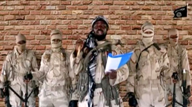 FILE PHOTO: Boko Haram leader Abubakar Shekau speaks in front of guards in an unknown location in Nigeria in this still image taken from an undated video obtained on January 15, 2018. Boko Haram Handout/Sahara Reporters via REUTERS