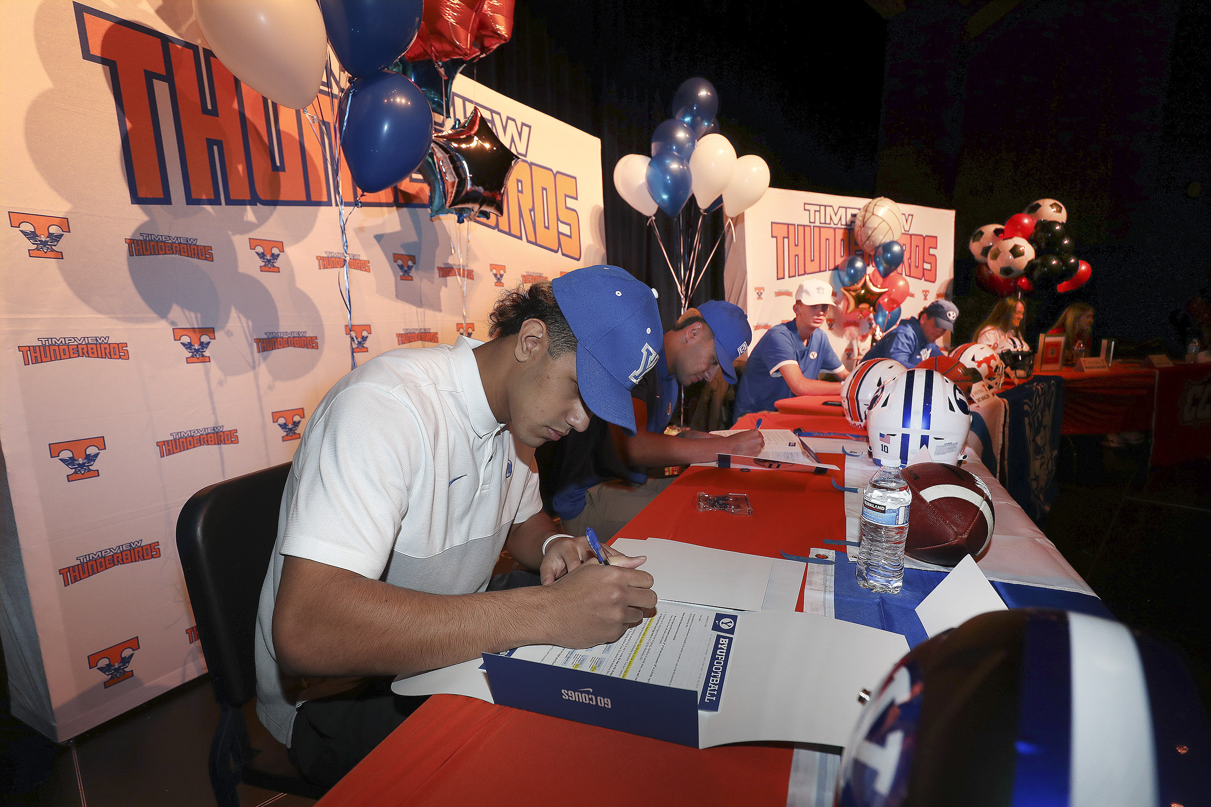 Timpview High School football player Logan Fano signs a letter of intent to play for BYU during a signing day event at the school in Orem on Wednesday, Dec. 16, 2020.
