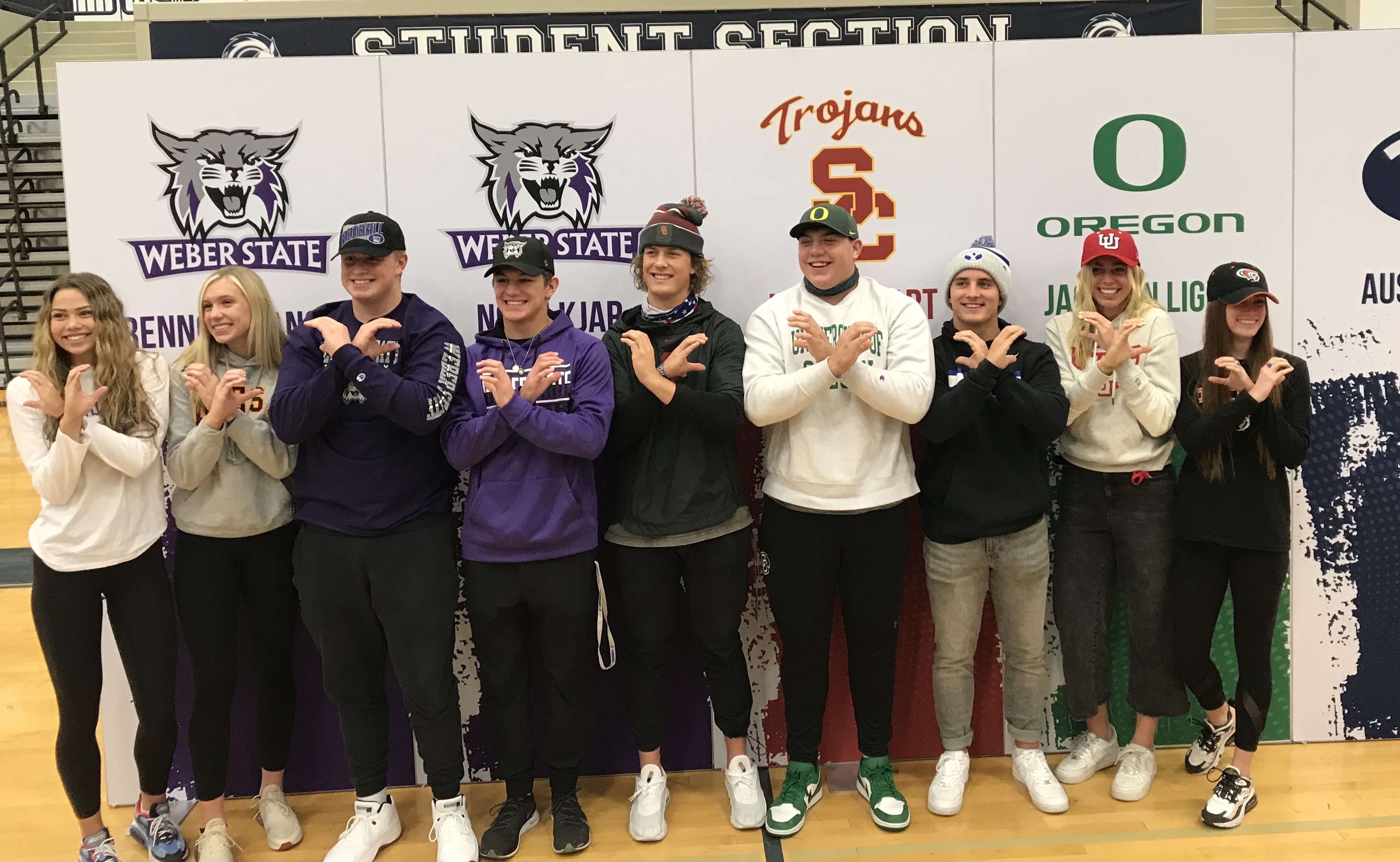 Oregon-bound center Jackson Light, middle, with Corner Canyon teammates after signing a letter of intent to play football for the Ducks, Wednesday, Dec. 16, 2020 in Draper, Utah.