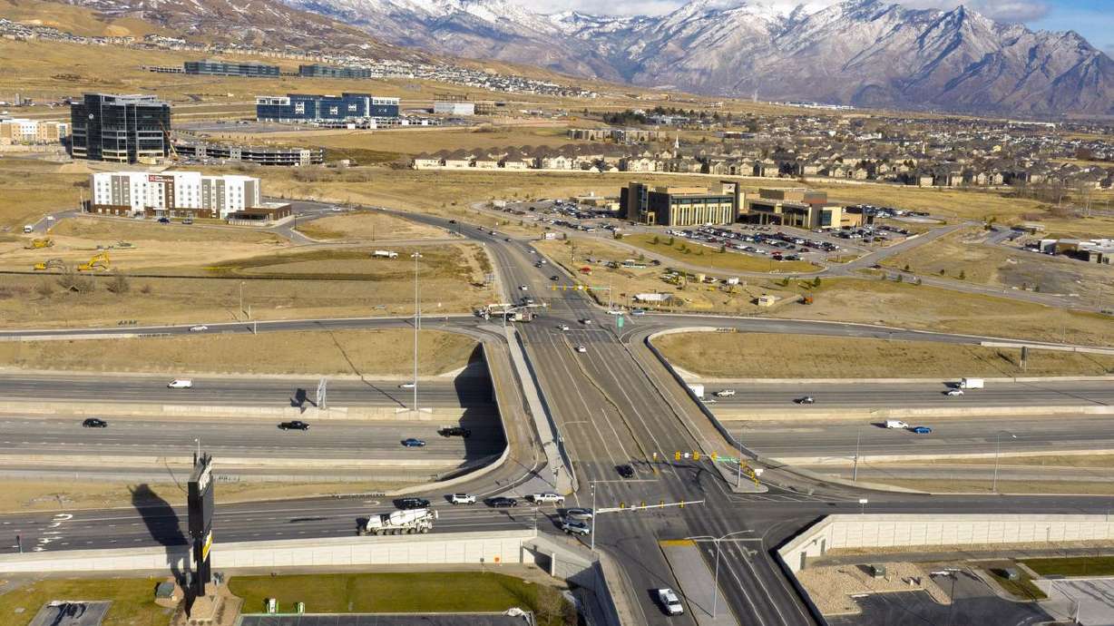Traffic moves along Triumph Boulevard as it passes over
I-15 in Lehi on Wednesday, Dec. 16, 2020. The interchange was added
as part of the Utah Department of Transportation’s Technology
Corridor project, a three-year project that brought major revisions
to I-15, interchanges and surrounding roads from Lehi Main Street
to state Route 92.