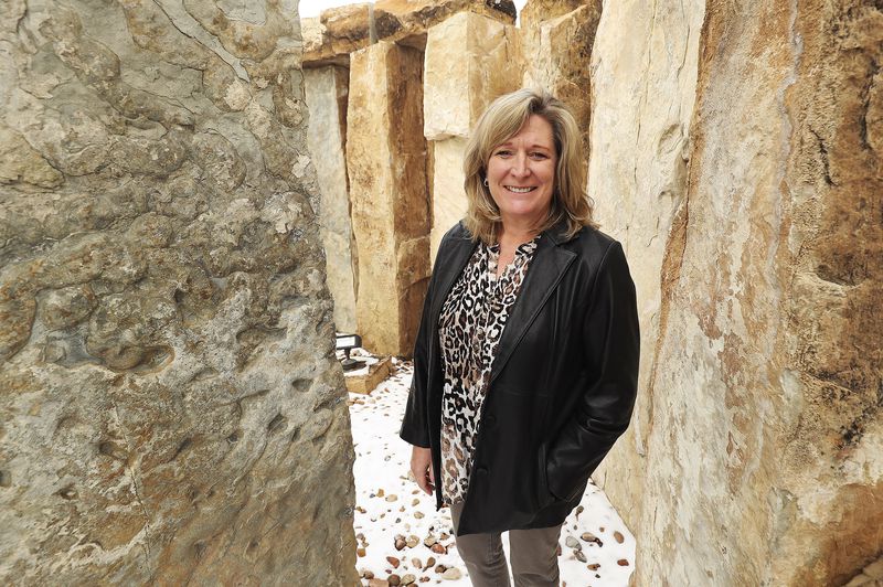 Tina Anderson, a physical therapy assistant, poses
outside of her office in Provo on Wednesday, Dec. 16, 2020.
Anderson is a cancer patient who is having her surgery paid for by
donations collected by Swig.