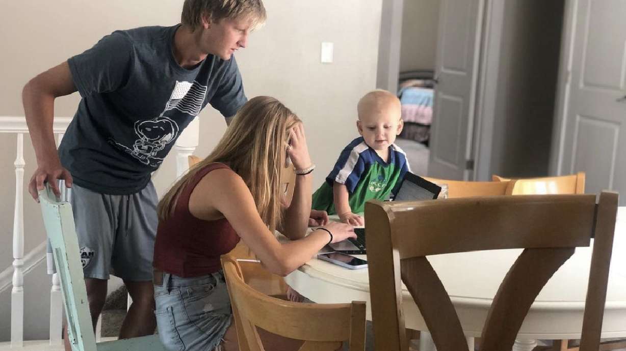 Arianne Brown's two oldest kids work together on their distance learning school work.