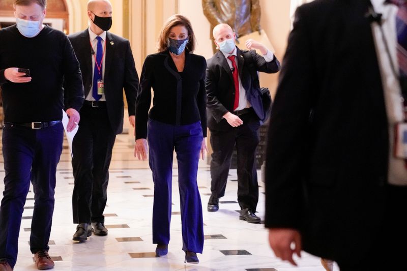 FILE PHOTO: U.S. Speaker of the House Nancy Pelosi (D-CA) walks through the U.S. Capitol in Washington, U.S., December 16, 2020. REUTERS/Erin Scott/File Photo