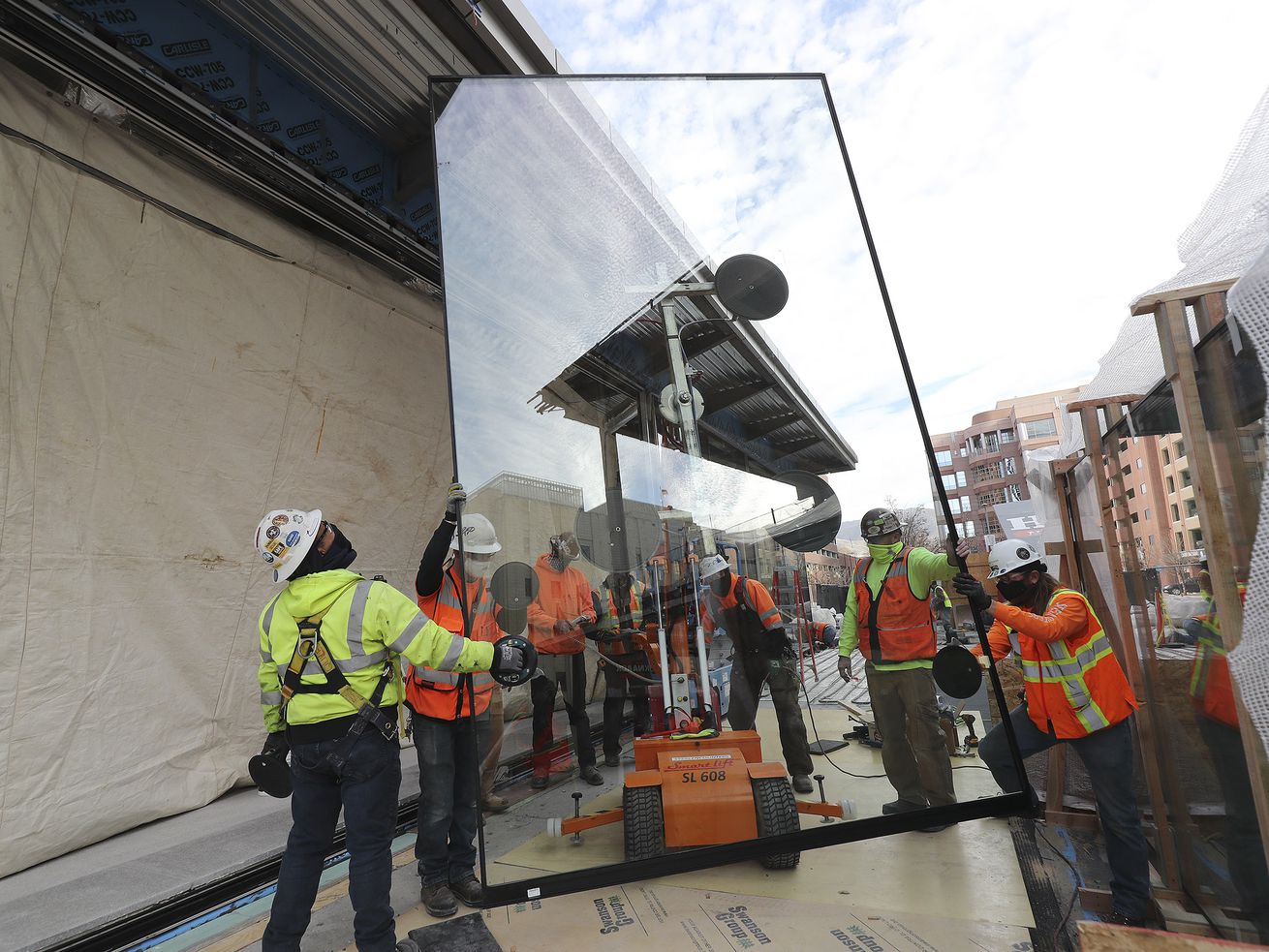 Animated slider doors are installed at 95 State at City
Creek in Salt Lake City on Wednesday, Nov. 25, 2020. The
515,000-square-foot 25-story Class A office tower will feature
cutting-edge technology incorporating state-of-the-art enhancements
that allows touchless entry from the main door and throughout the
property, thereby creating a safer and healthier workplace
experience for tenants and visitors.