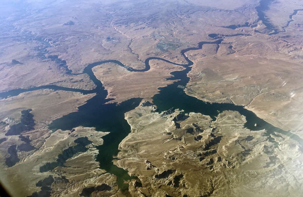 FILE - In this Sept. 11, 2019, file photo, is an aerial view of Lake Powell on the Colorado River along the Arizona-Utah border. A set of guidelines for managing the Colorado River helped several states through a dry spell, but it's not enough to keep key reservoirs in the American West from plummeting amid persistent drought and climate change, according to a U.S. report released Friday, Dec. 18, 2020.