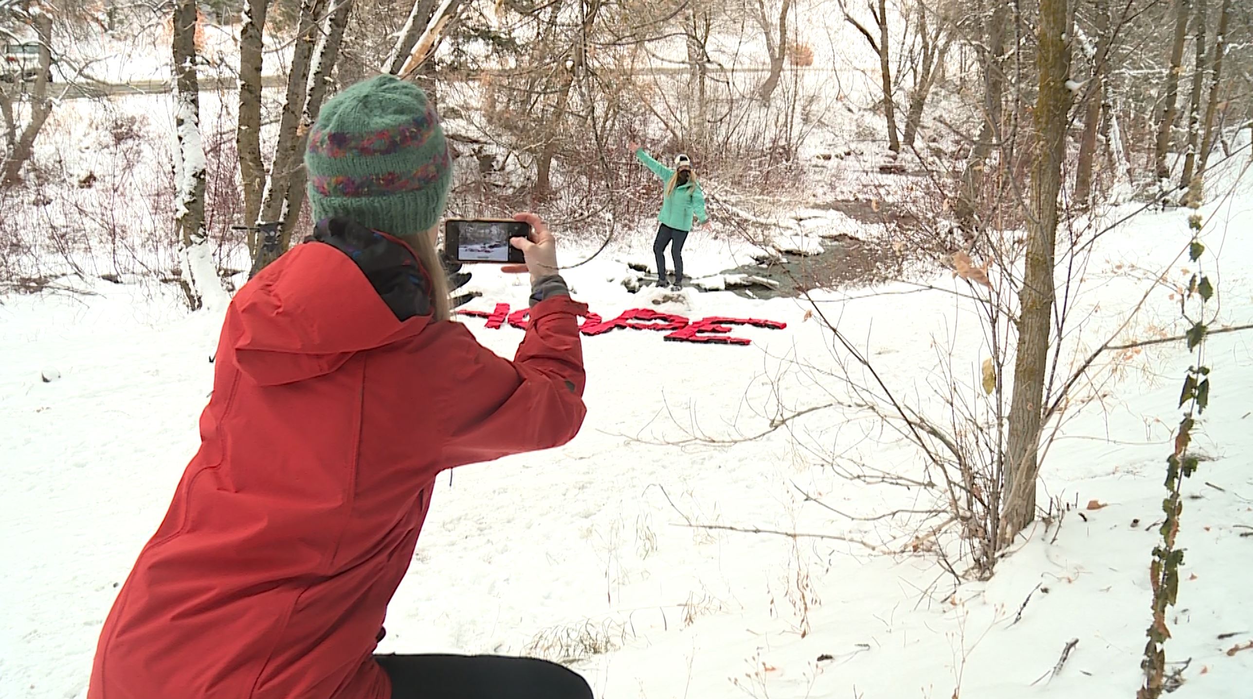 After Sheryl McGlochlin has finished her creation in the snow, she snaps a photo and sends it to her loved one.