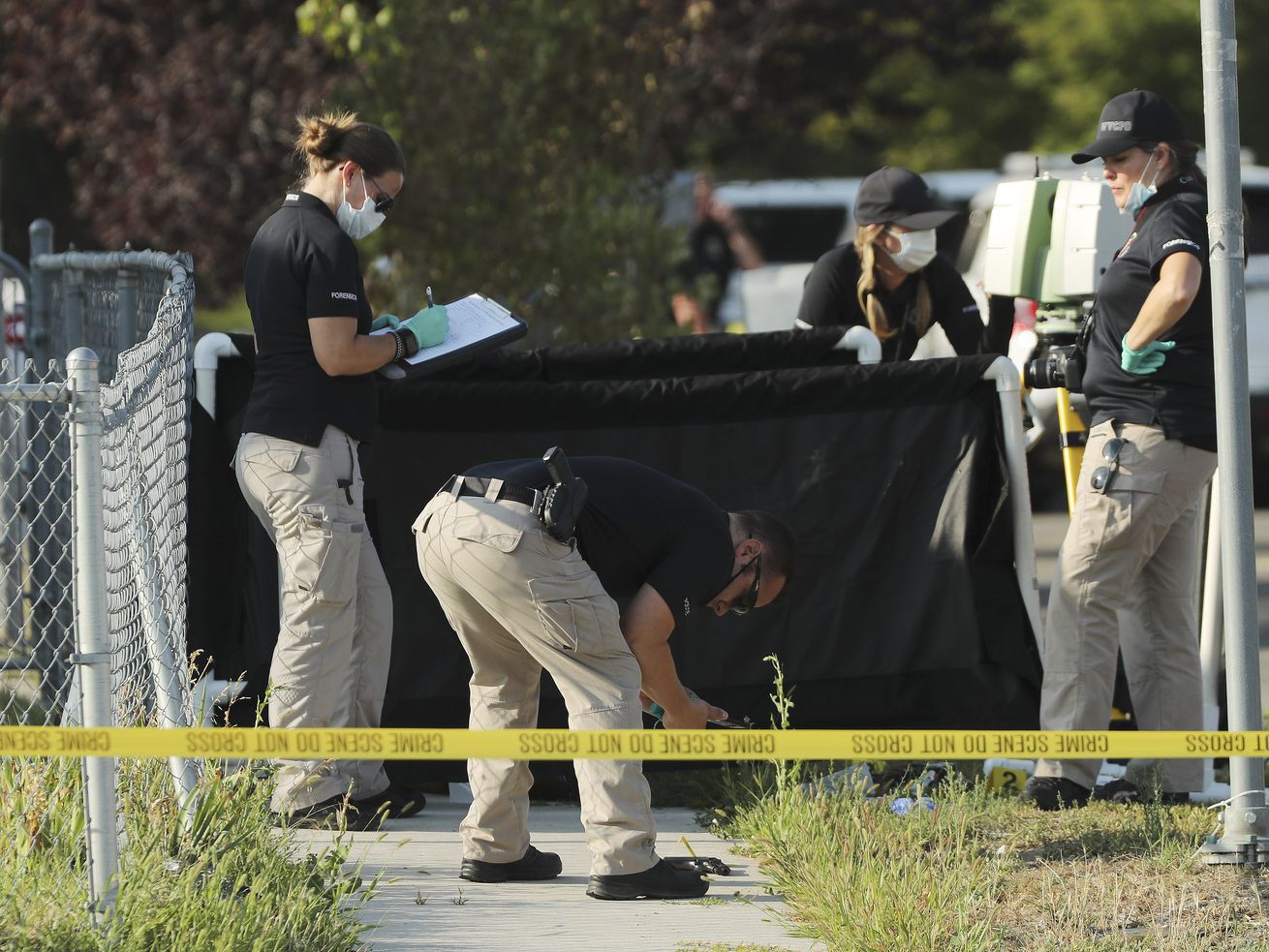 Police investigate an officer-involved shooting at 5400
South and 5400 West in Kearns on Tuesday, Aug. 4, 2020.